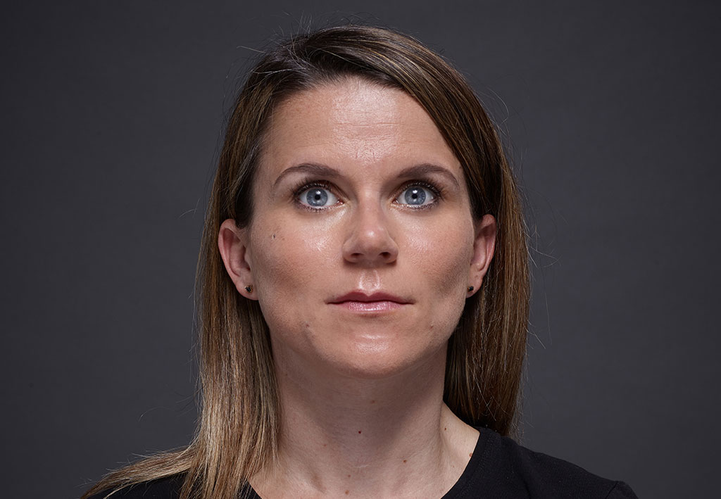 Dark Blond woman with blue eyes on grey background | Fillmed