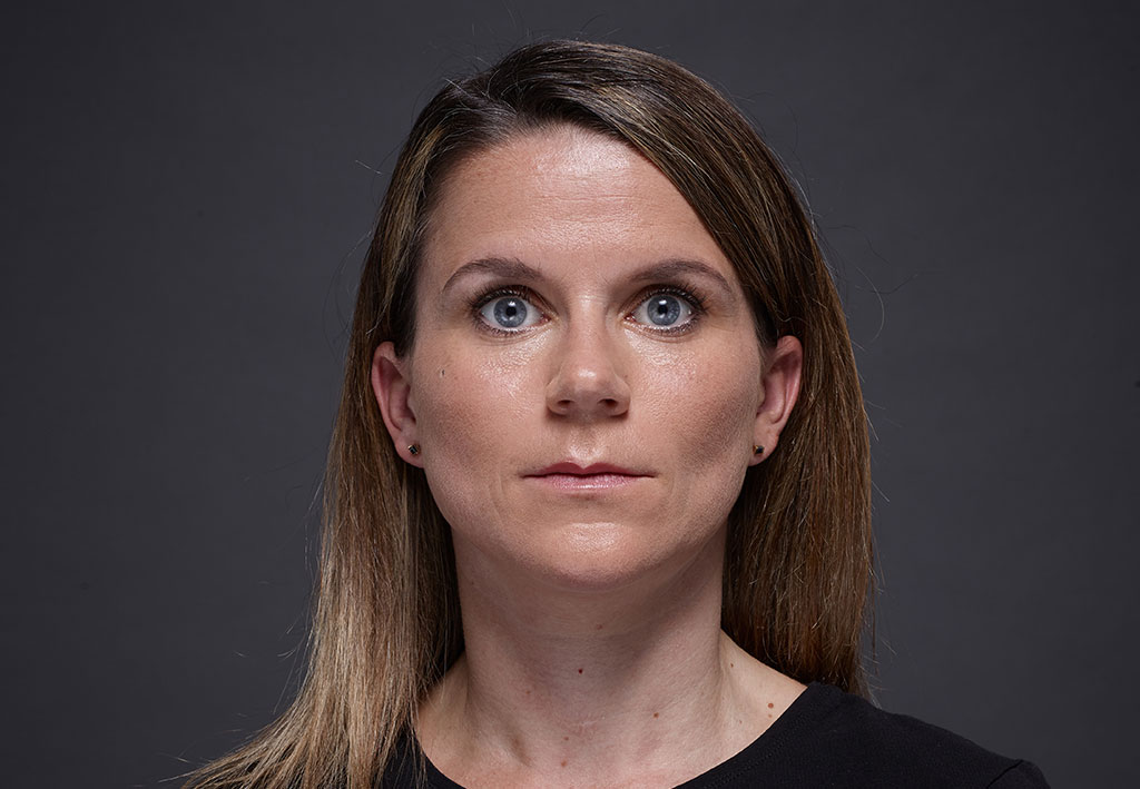 Dark Blond woman with blue eyes on grey background | Fillmed