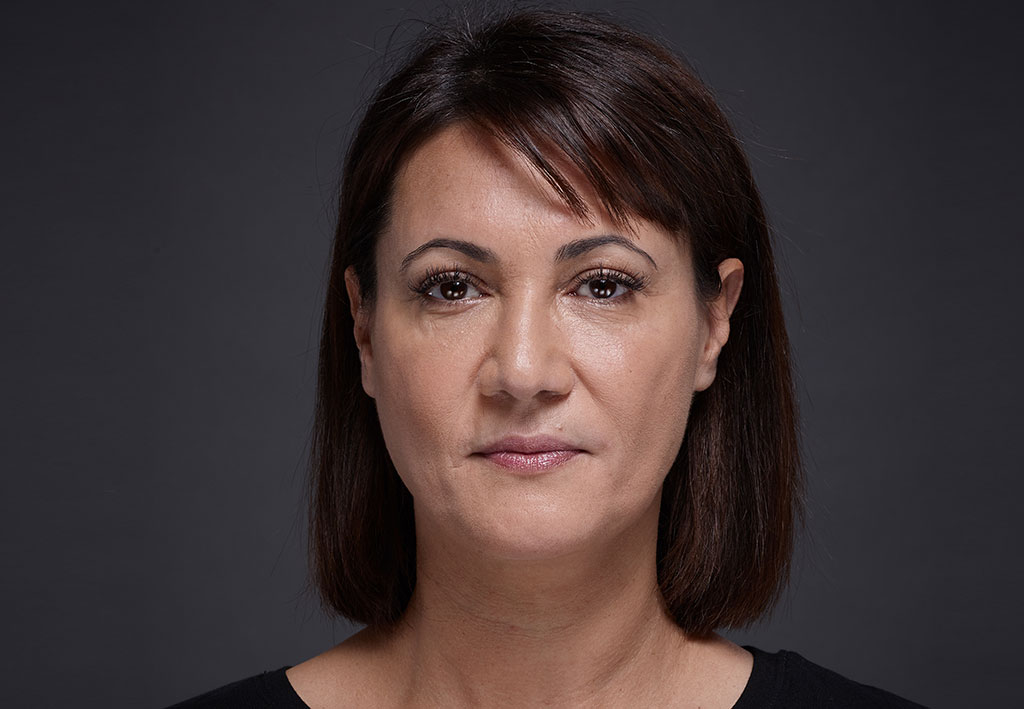 Woman face with brown eyes on grey background | Fillmed